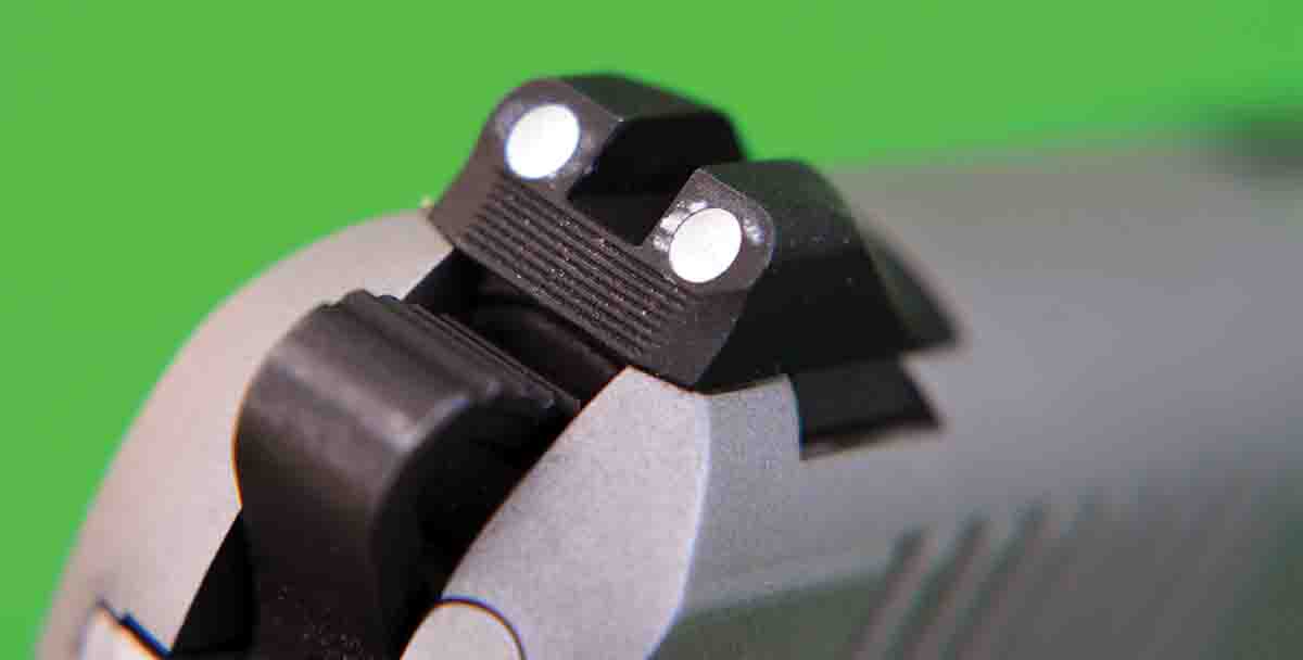 The rear sight of the Kimber Micro 9 is dovetailed into the slide and features two white dots.